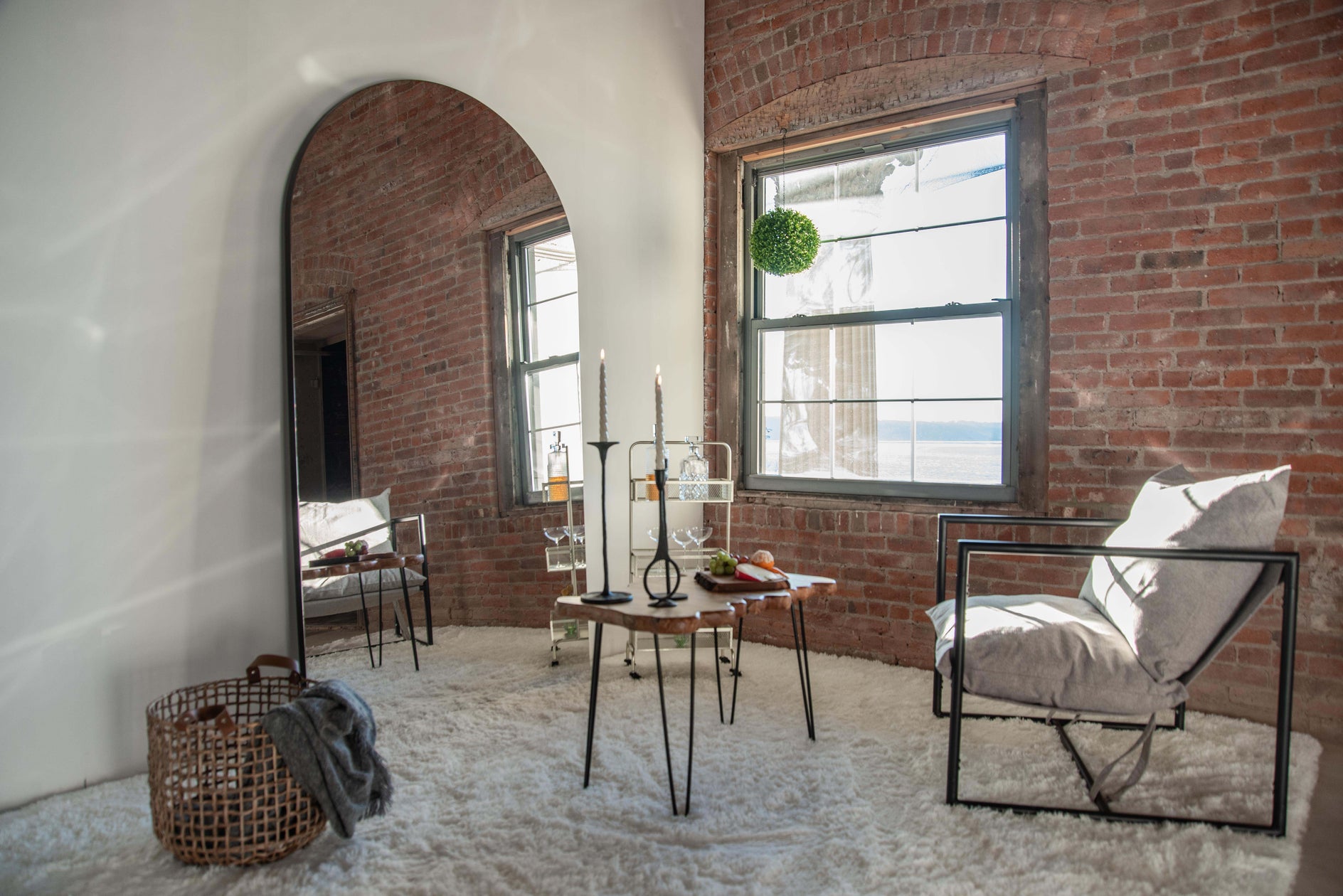 Arched, full-length mirror in a mid-century modern living room