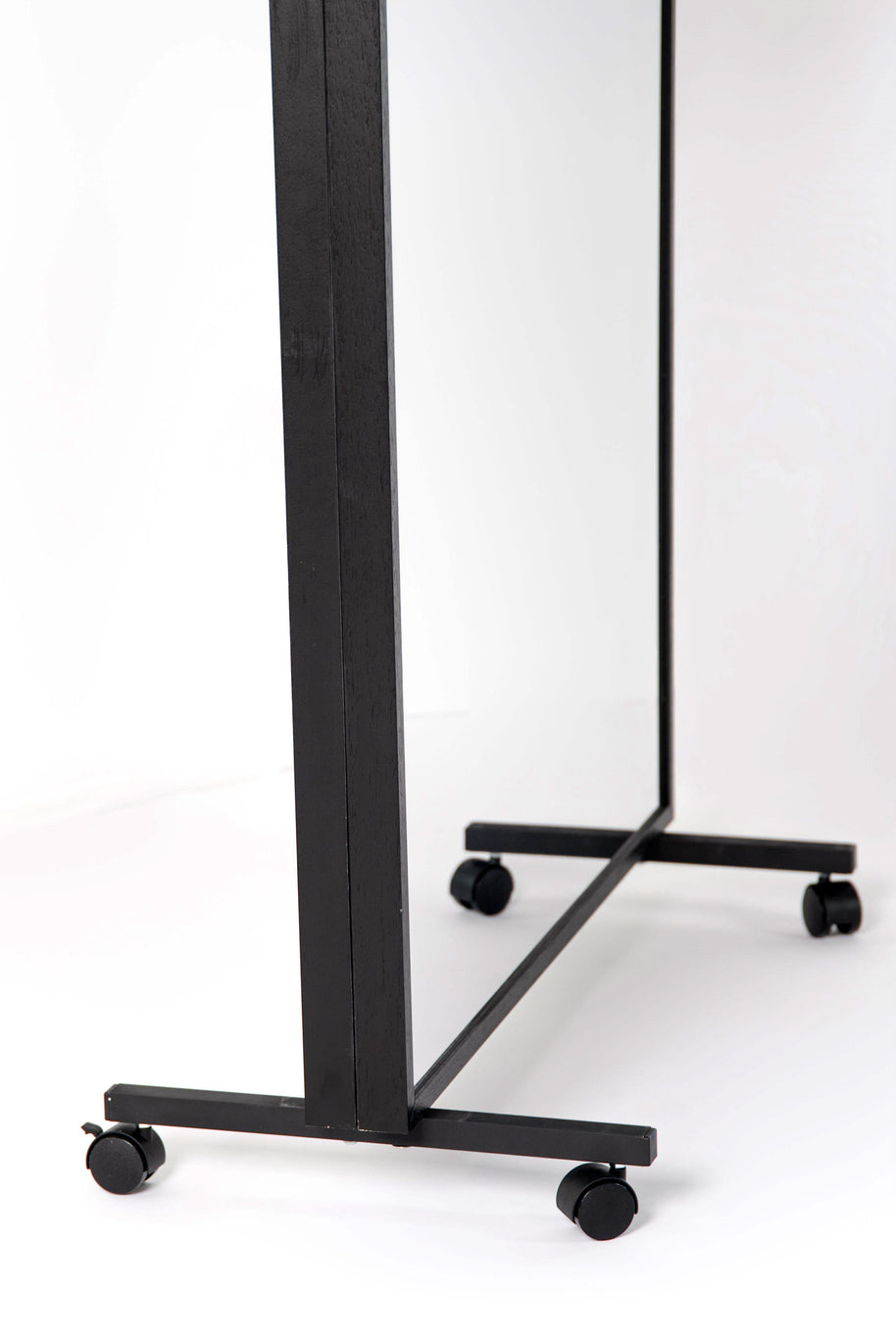 Close up of double-sided LiteMirror with black wood frame and portable rolling stands on white background