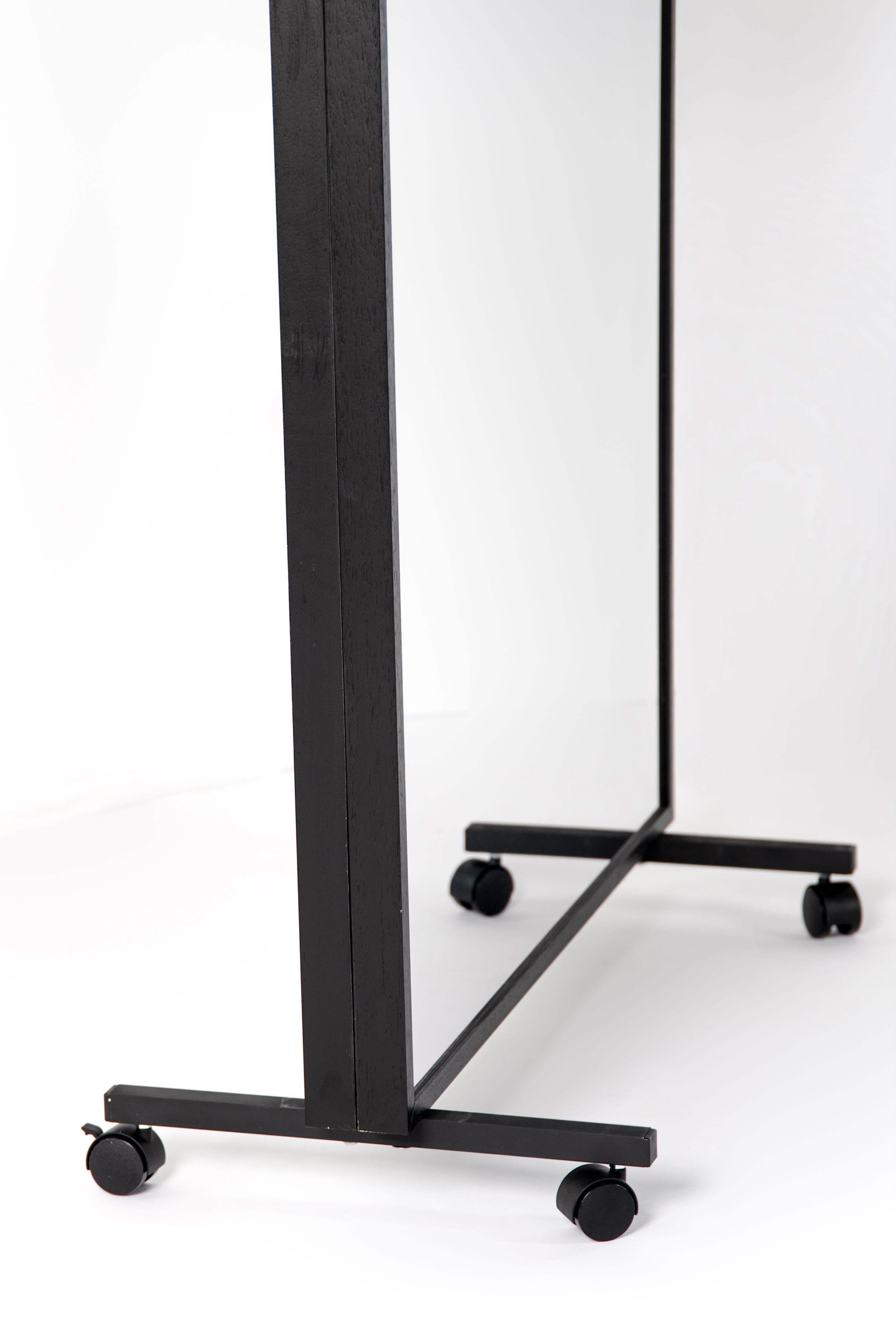 Close up of double-sided LiteMirror with black wood frame and portable rolling stands on white background