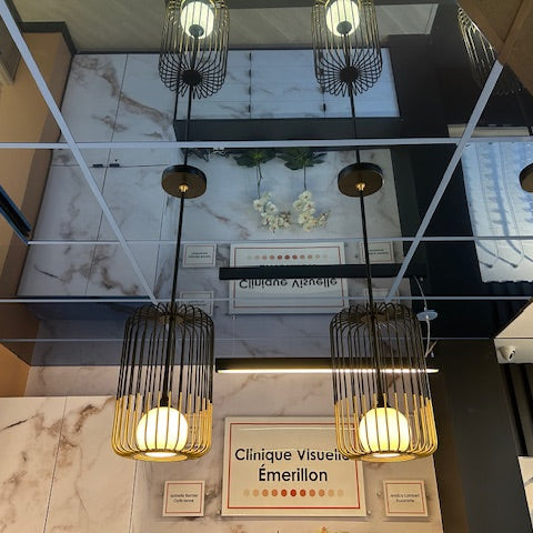 Ceiling tile mirrors in a display design booth 