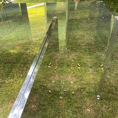Reflective LiteMirror panels set as a maze on a grassy field