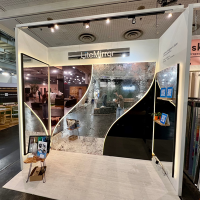 Display of LiteMirror custom products and shapes at a trade show booth