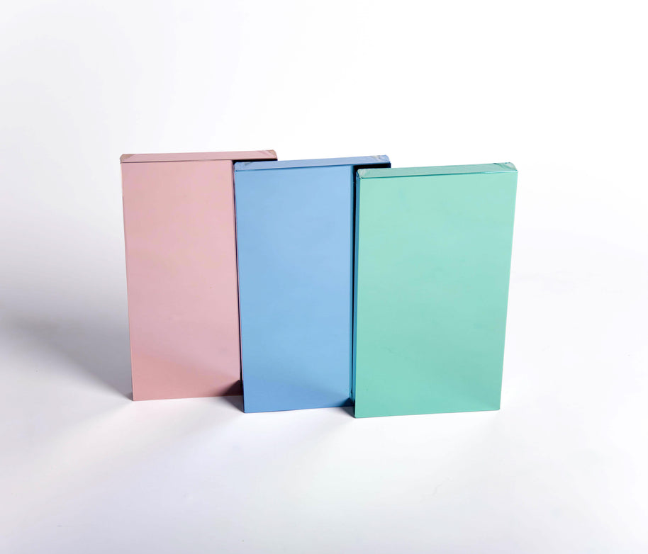 Rose, teal and blue film mirror color samples on white background