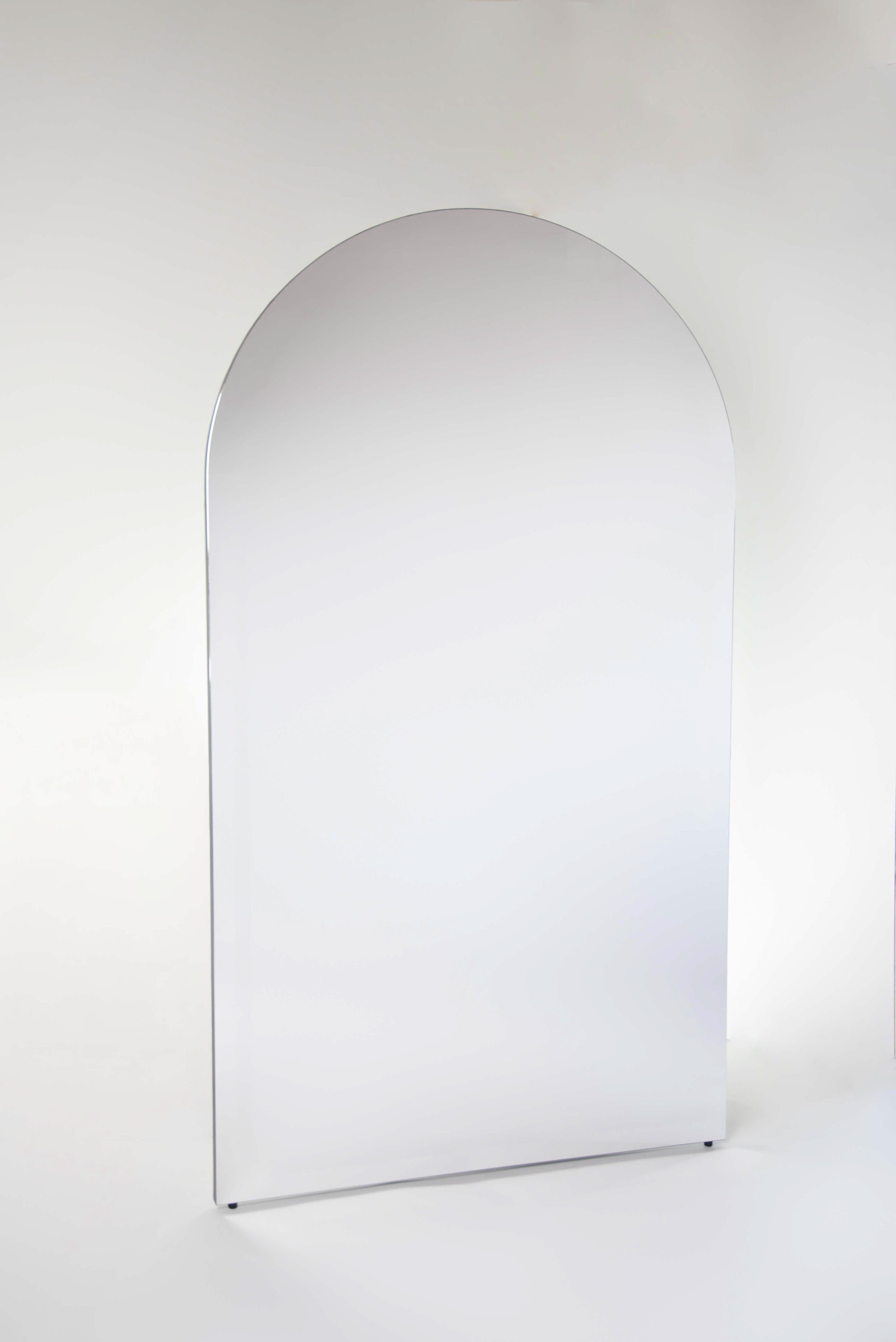 Arched mirror on a white background
