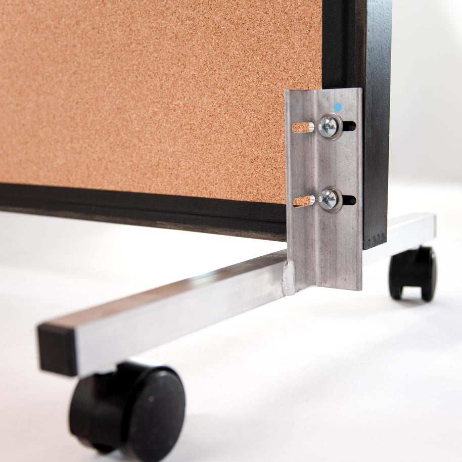 Cork bulletin board backing on mirror with metal wheels on a white background