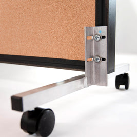Cork bulletin board backing on mirror with metal wheels on a white background